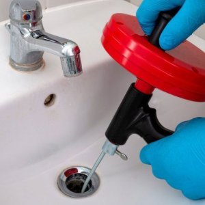 Why do plumbers say not to use drain cleaner?