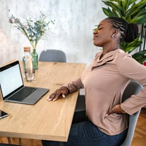 How can desk workers relieve tight lower body stiffness without gym equipment?