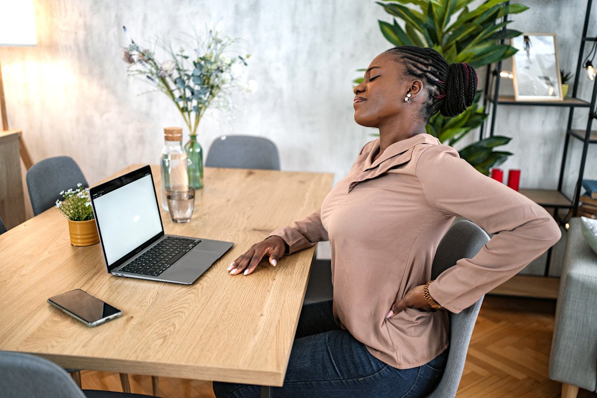 How can desk workers relieve tight lower body stiffness without gym equipment?